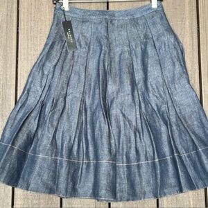 New with Tags!  Cute pleated Talbots skirt. Denim color. Size 0 Petite.